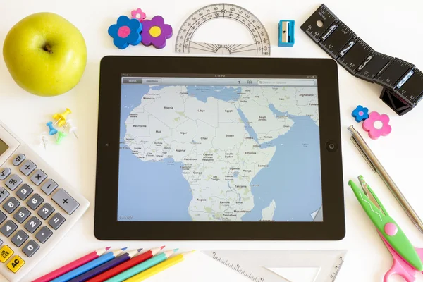 Ipad 3 with maps and school accesories — Stock Photo, Image
