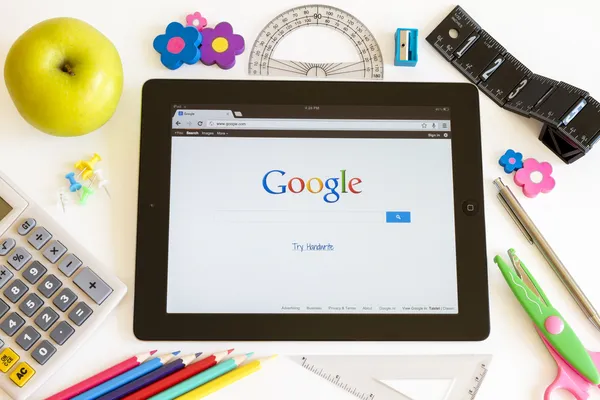 Google on Ipad 3 with school accesories — Stock Photo, Image