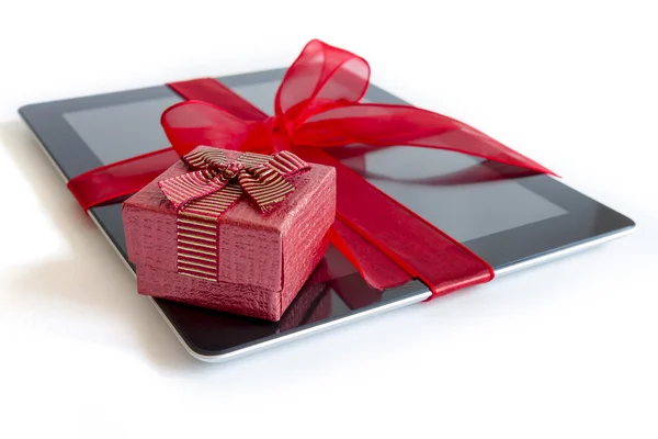 Digital tablet with christmas present — Stock Photo, Image