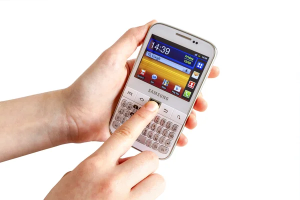 Hand holding Samsung Galaxy Y Pro B5510 — Stock Photo, Image