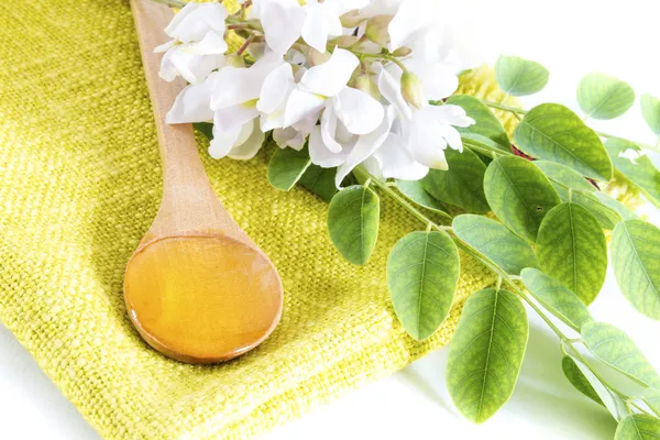 Acacia honey in spoon — Stock Photo, Image