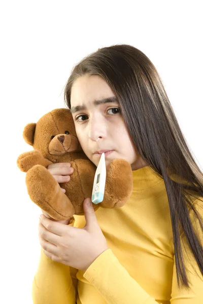Cute sick girl measures her temperature — Stock Photo, Image