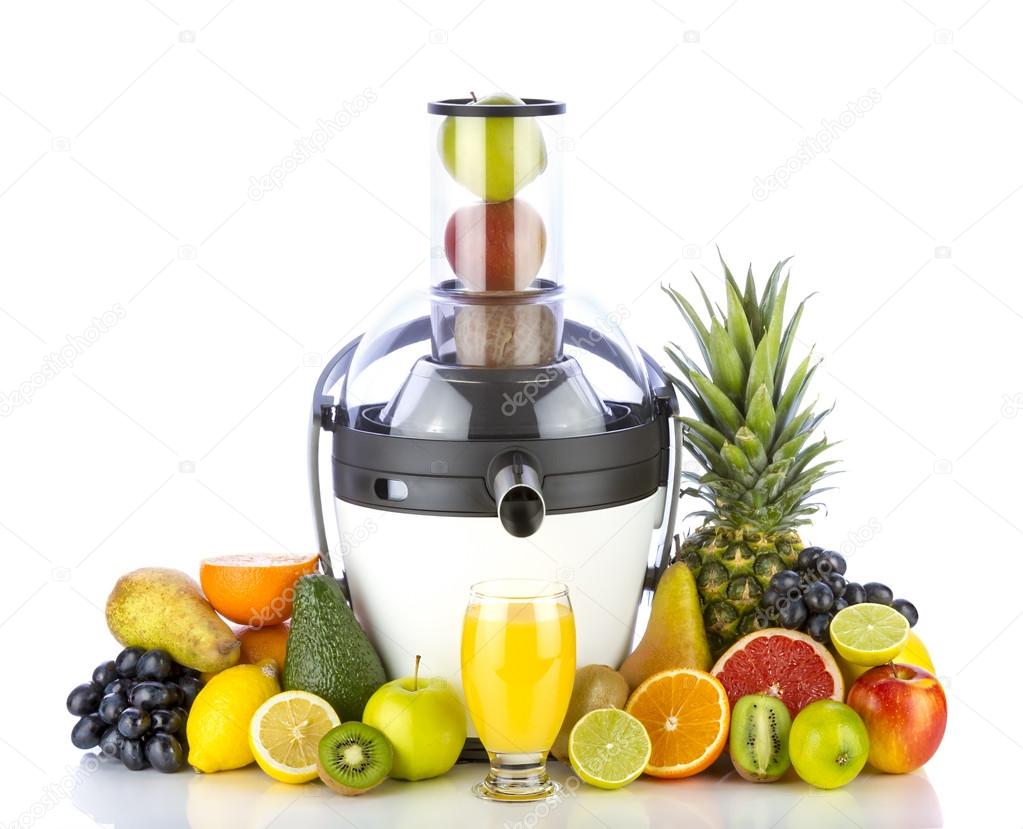 Fresh fruits and glass with juice near white juicer