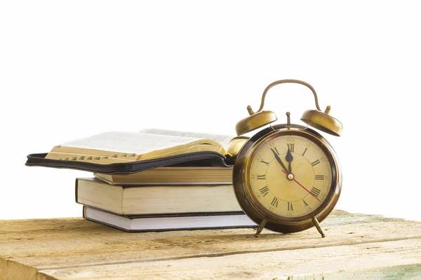 Bible with clock on wood — Stock Photo, Image