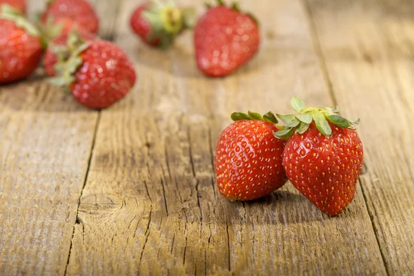 Fresh strawberries on wooden table — Stock Photo, Image