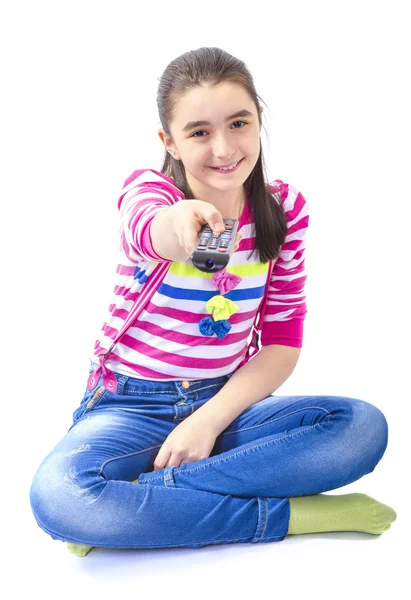 Felice bambina con telecomando guardando la tv — Foto Stock