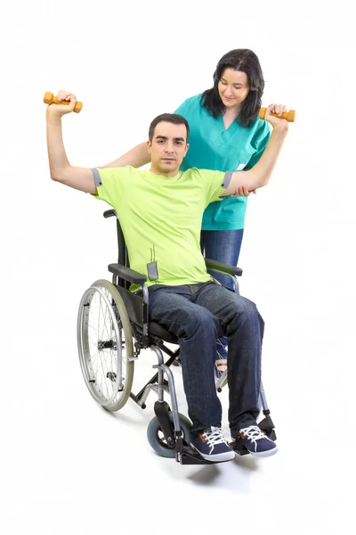 Therapist assists patient with weightlifting — Stock Photo, Image