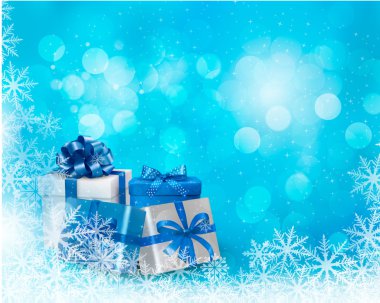 hediye kutusu ve kar tanesi Noel mavi arka plan.