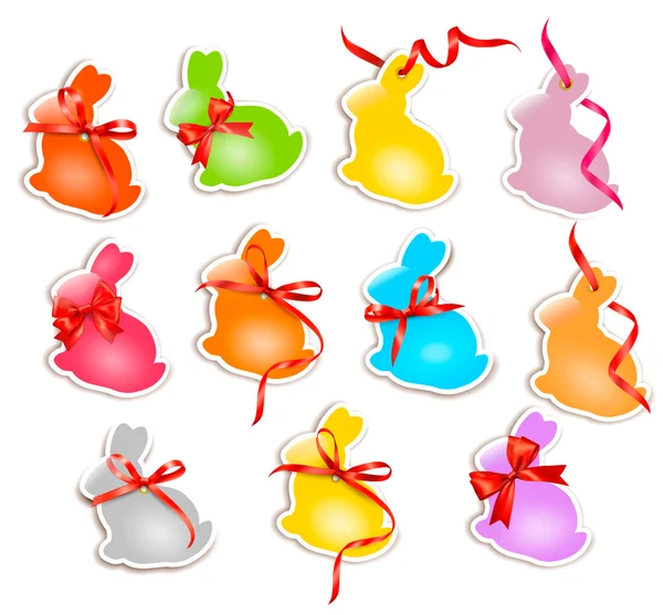 Decoratieve Pasen konijnen. Pasen kaarten met linten en rode boog — Stockvector