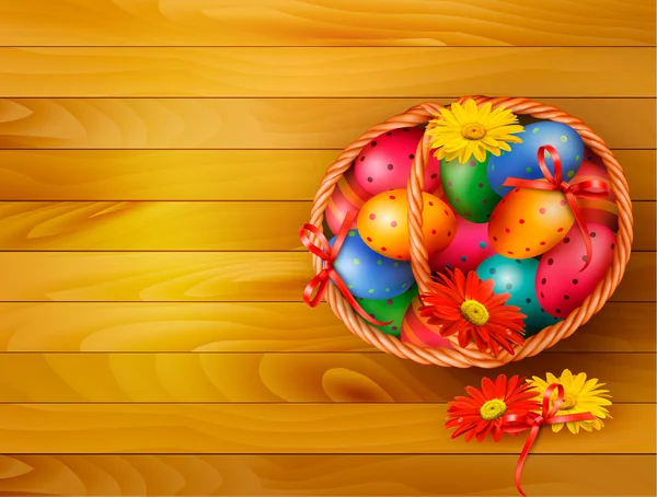 Sfondo di Pasqua con uova di Pasqua a colori nel cestino su scheda di legno — Vettoriale Stock