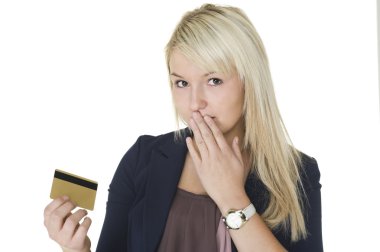 Woman with guilty look holding credit card clipart