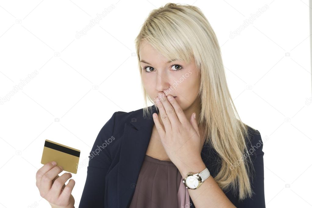 Woman with guilty look holding credit card
