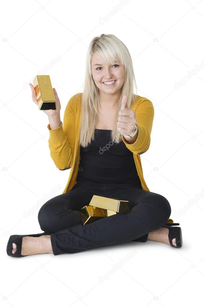 Woman with gold bars giving thumbs up