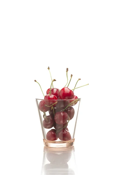 Glass full of luscious ripe red cherries — Stock Photo, Image