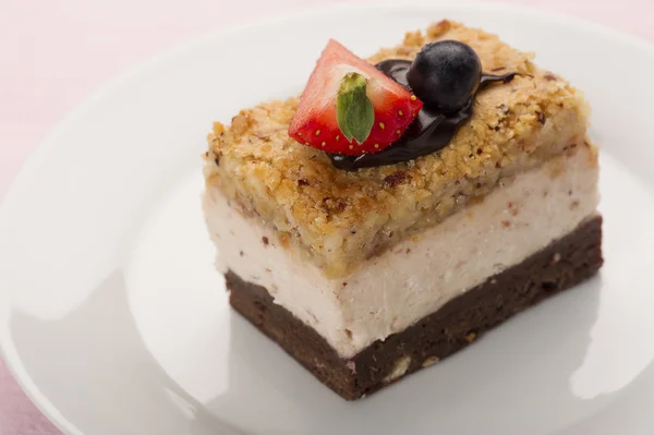 Tasty looking dessert with strawberry on top — Stock Photo, Image