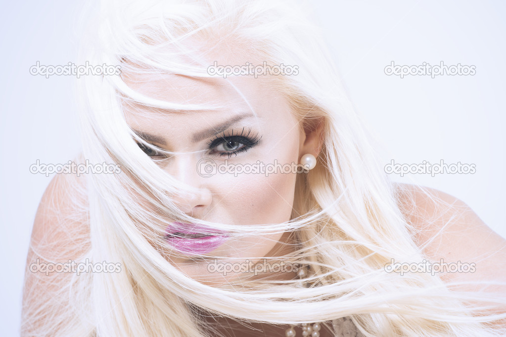 Blonde model with hair across face