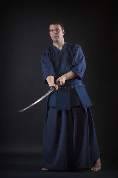 Kendo fighter posing with bokken — Stock Photo, Image