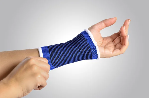 Hand with a orthopedic wrist brace — Stock Photo, Image