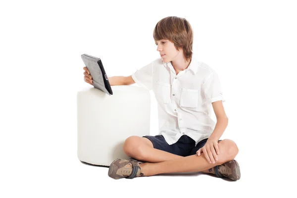 Teenage boy with the tablet computer — Stock Photo, Image