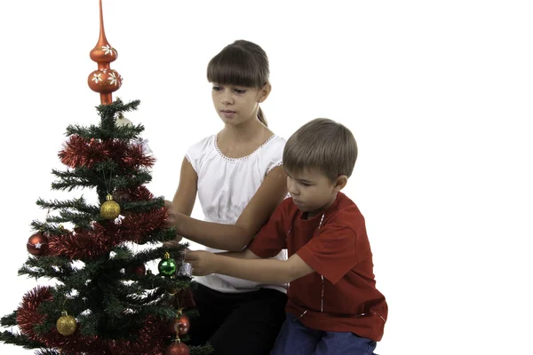 Children decorate the Christmas tree — Stock Photo, Image