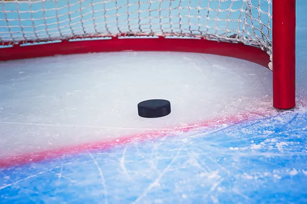 Hockey puck crossing goal line — Stock Photo, Image