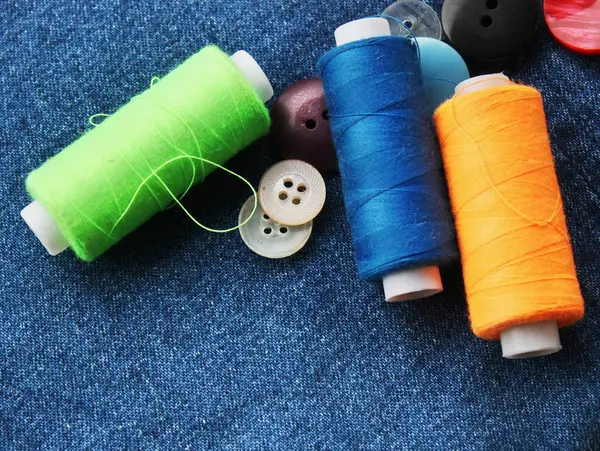 Color threads with buttons — Stock Photo, Image