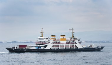 Ferries carrying passengers and vehicles between Yalova and Istanbul clipart