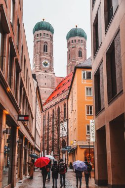 Munich, Germany - DEC 26, 2021: Exterior view of Frauenkirche, The Cathedral of Our Lady in Munich, Bavaria, Germany. The structure is the most iconic building of Munich. clipart