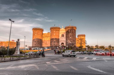 Naples, Italy - April 8, 2022: Castel Nuovo or Maschio Angioino is a medieval castle located in front of Piazza Municipio and the city hall (Palazzo San Giacomo) in Naples, Campania, Italy. clipart