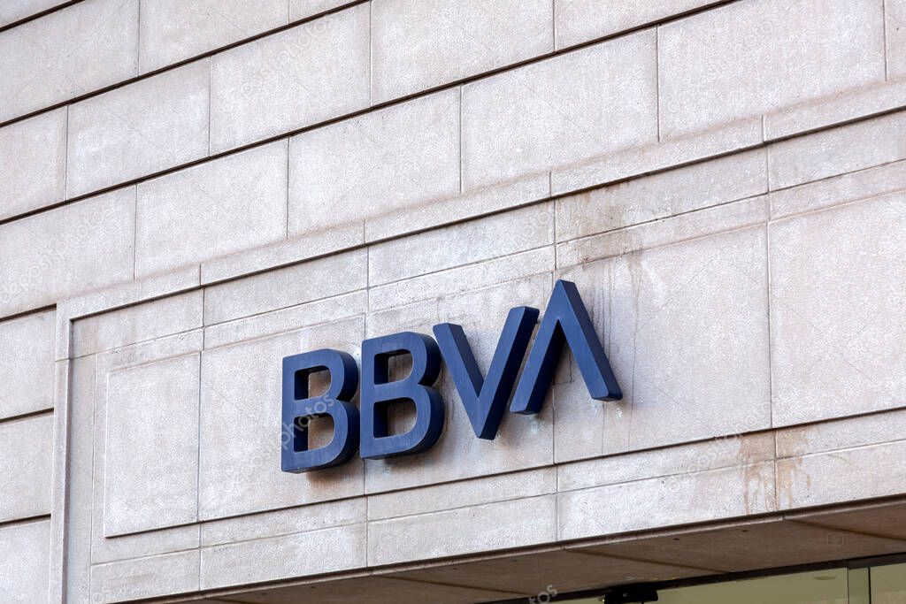 Barcelona, Spain - February 10, 2022: BBVA bank signage and entrance, Passeig de Gracia, Barcelona, Spain.