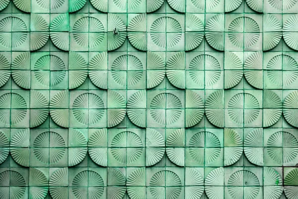Mid-century modern style tiled wall with half circle decorations, architectural detail design element