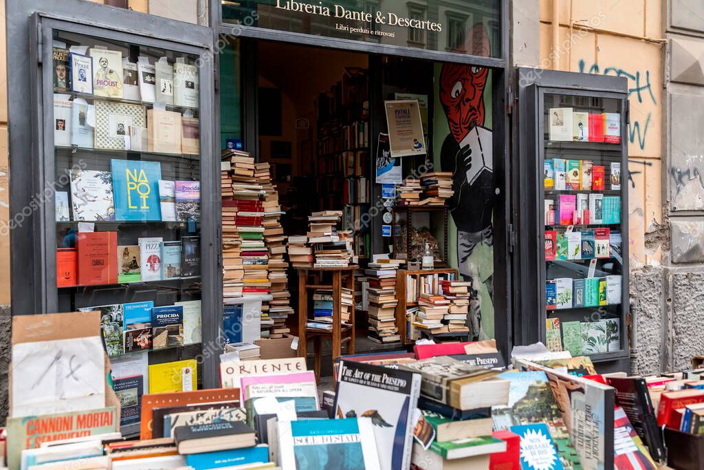 Naples, Italy - APR 9, 2022: Second hand used books for sale on a bookstores stand at the Piazza Gesu Nuovo