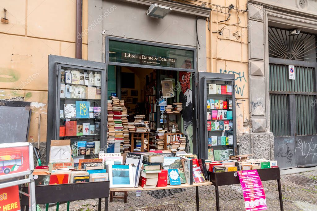Naples, Italy - APR 9, 2022: Second hand used books for sale on a bookstores stand at the Piazza Gesu Nuovo