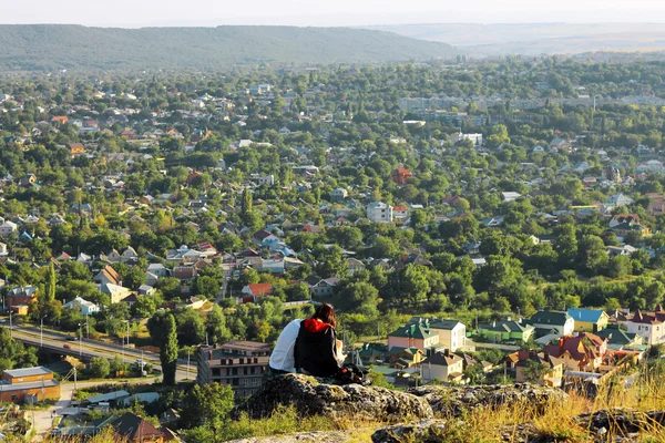 Boy and girl sitting on the stone — Stock Photo, Image