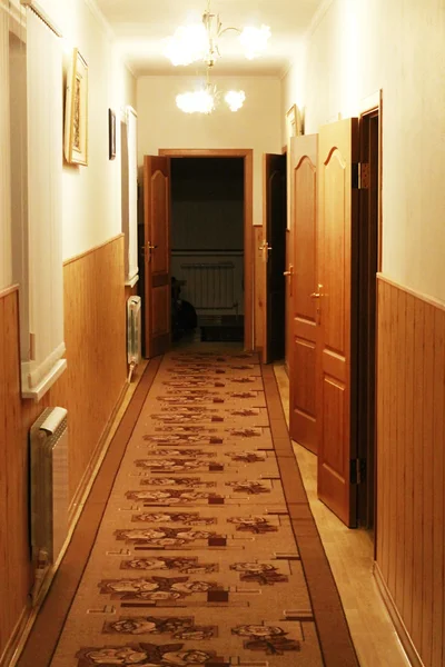 Hallway with doors in the small hotel