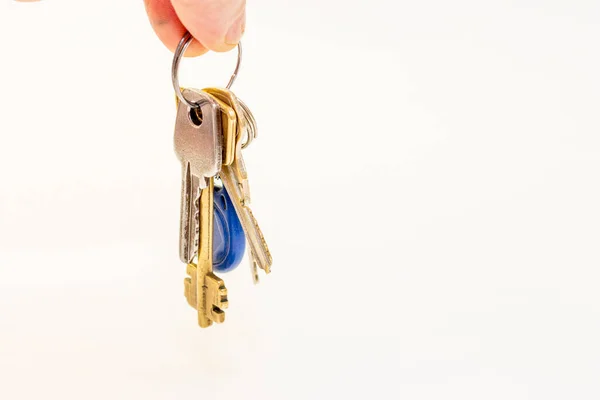 Man Hold Bunch Different Flat Keys Isolated White Background — Stock Photo, Image
