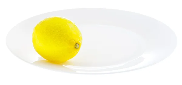Limão amarelo brilhante na placa branca — Fotografia de Stock