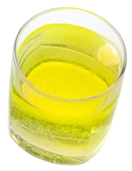 Glass of yellow carbonated water with vitamin C — Stock Photo, Image