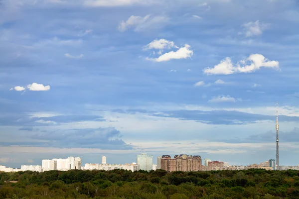 Blue autumn sky with clouds under city — Stock Photo, Image