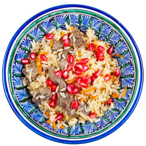 Top view on traditional asian pilaf with pomegranate — Stock Photo, Image