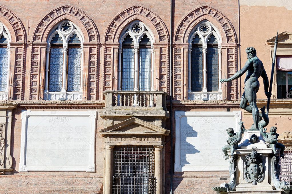 View on Fountain of Neptune and wall of town hall in Bologna