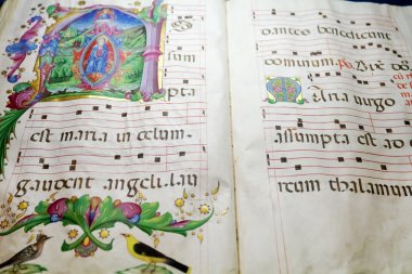 Medieval folio with choral note clipart