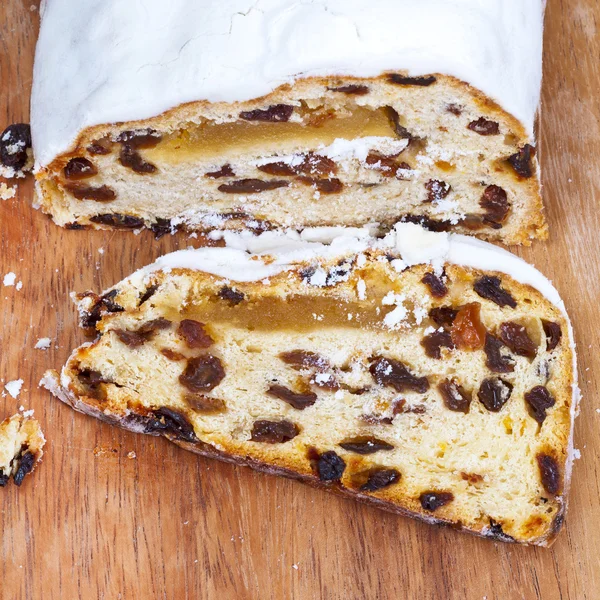 Sliced Stollen cake with dried fruit and marzipan — Stock Photo, Image