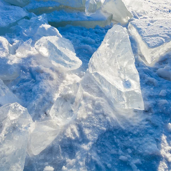 Block of clear river ice in cold winter day under sunbeams — Stock Photo, Image