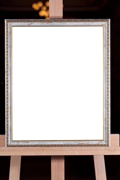 Silver picture frame on easel with dark background — Stock Photo, Image