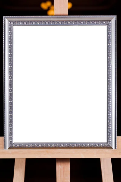 Silver picture frame on easel — Stock Photo, Image