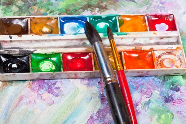 Set acquerello e pennelli su sfondo immagine ad olio — Foto Stock