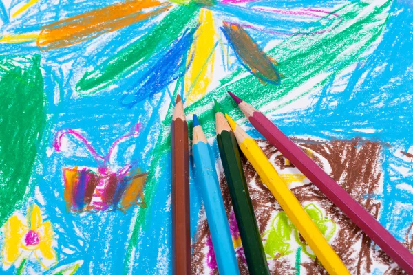 Several colored pencils on children draw — Stock Photo, Image