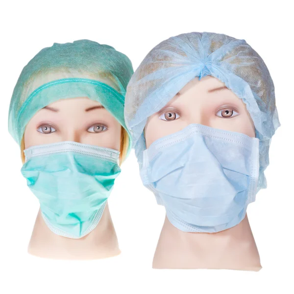 Cabeças de médico manequim vestindo tampa cirúrgica têxtil e máscara — Fotografia de Stock