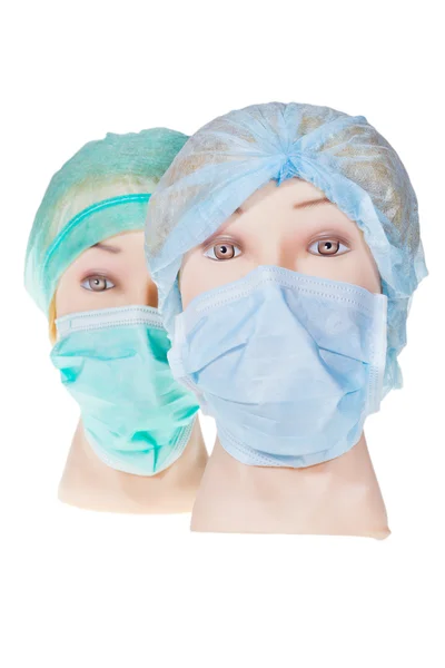 Лікарські голови в текстильній хірургічній шапці та масці — стокове фото